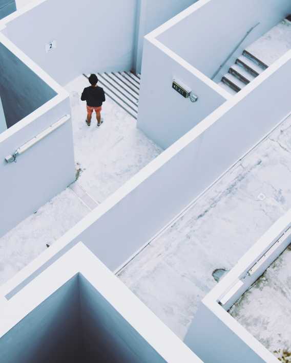 Man walking through maze